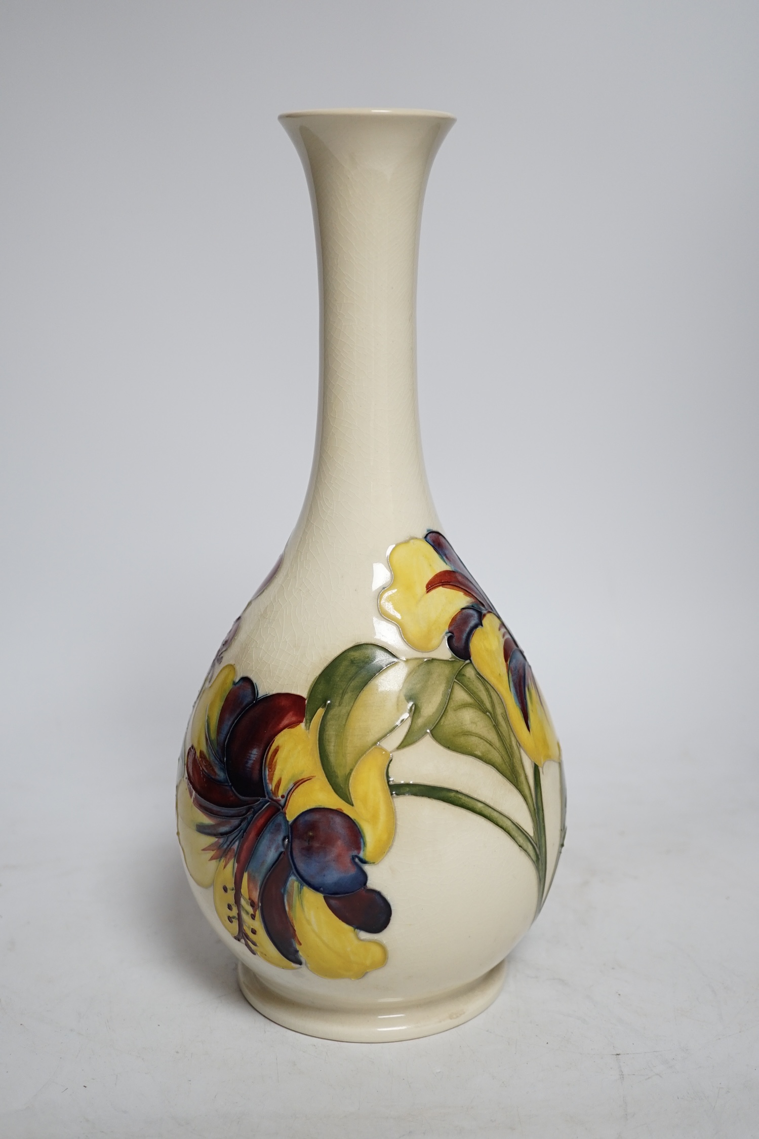 A Moorcroft cream ground Hibiscus vase, 31cm high